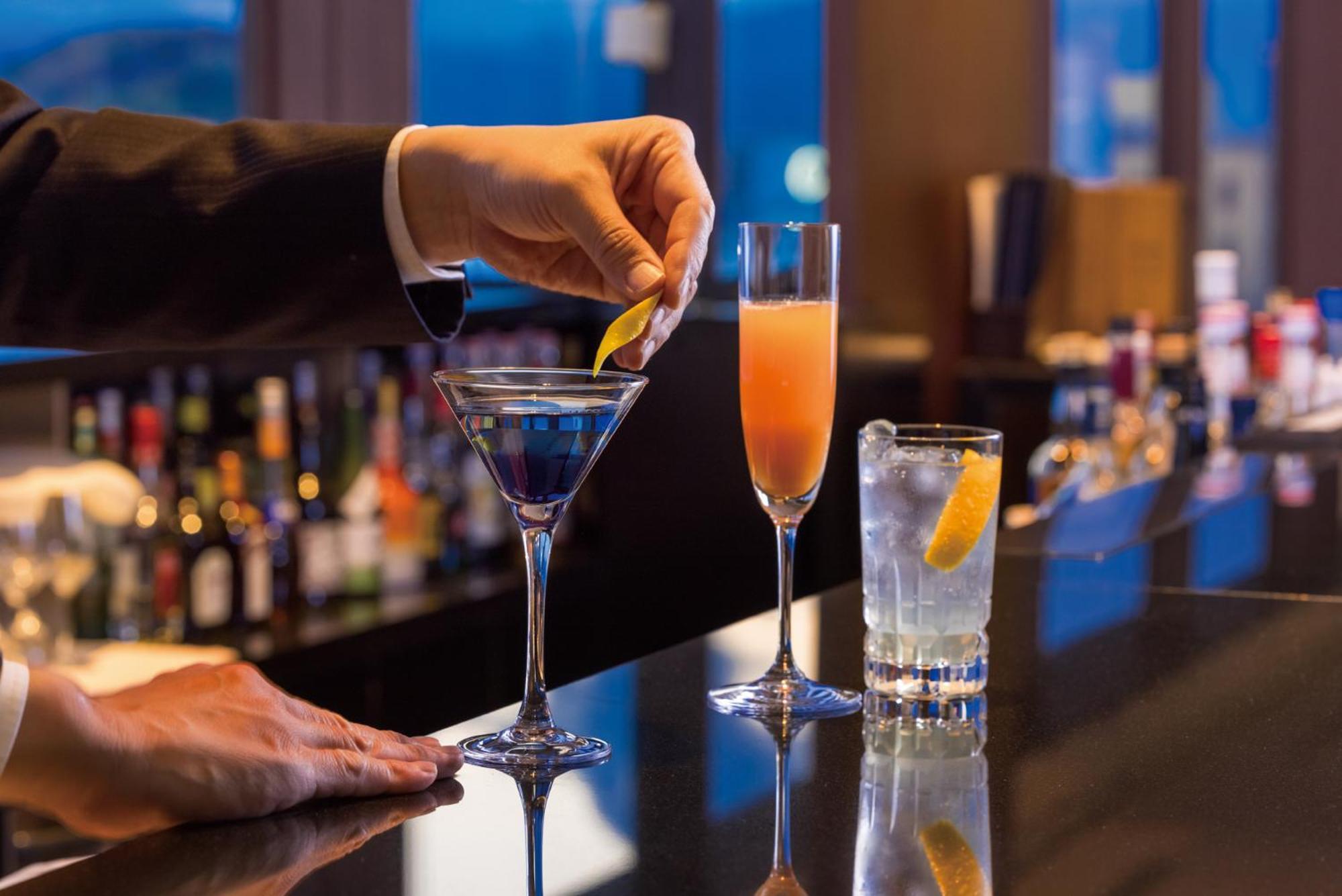 Hotel Associa Shizuoka Exterior photo A bartender adding a lemon twist to a martini